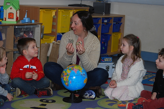 Diane Turner showing The Open University outreach meteorite collection to preschool children